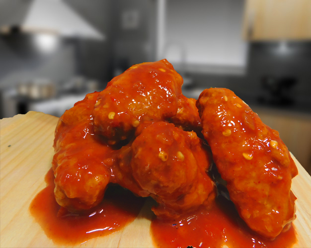 anuncio de salsa para alitas en sabor clasico cayene